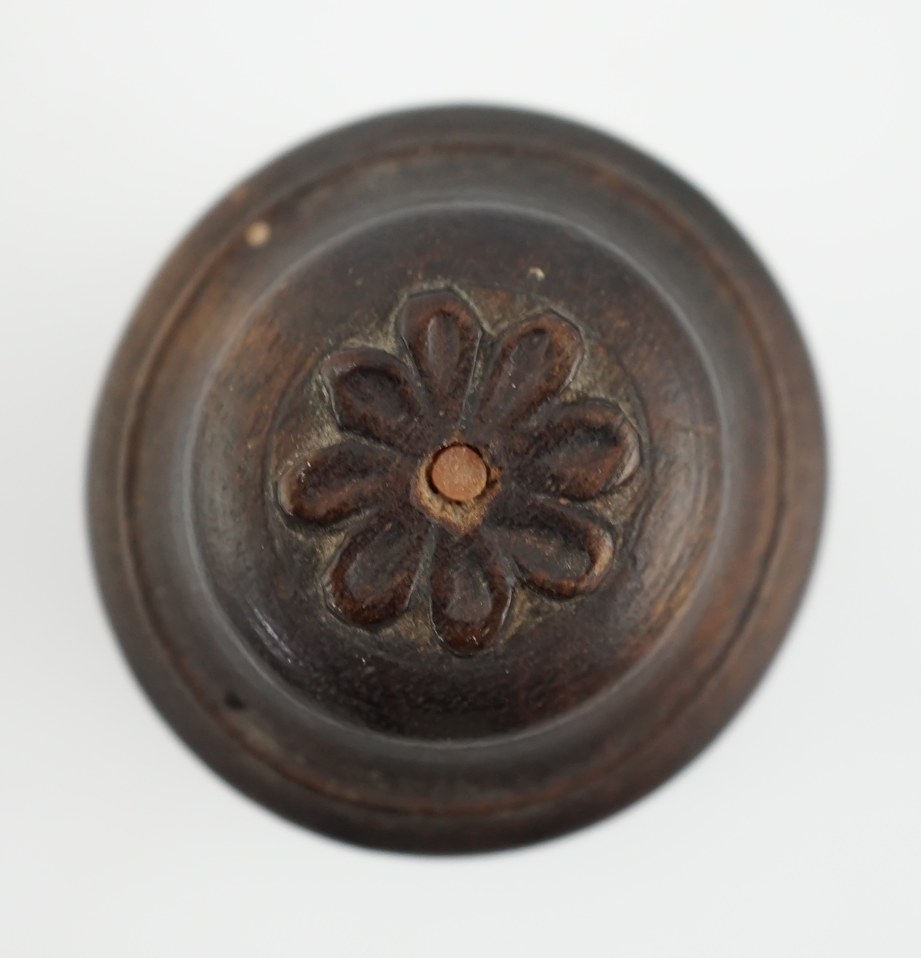 A Chinese jadeite archer's thumb ring, wood stand and cover, 19th century